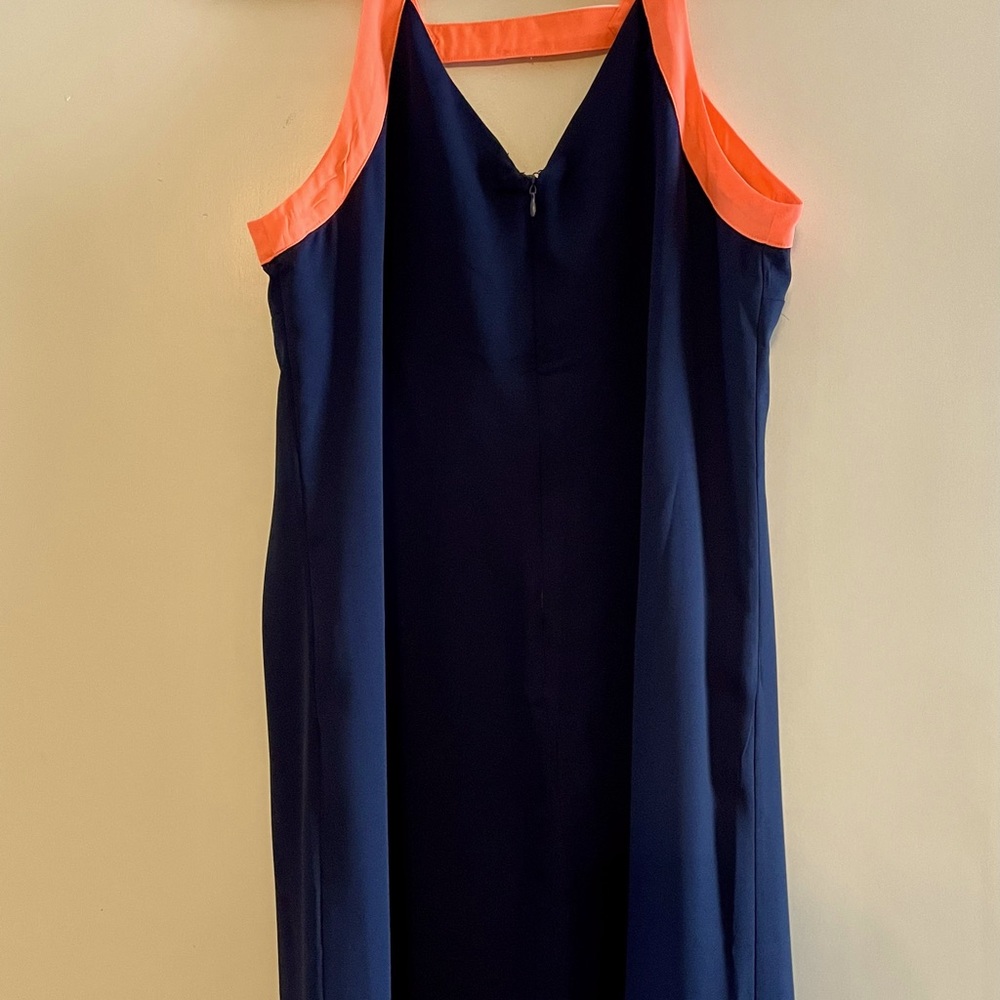 Skies are blue sleeveless navy and pink summer dress. New with tags. Size small.